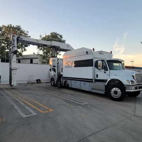Specialized Fleet Services mobile service truck with lift, parked in Los Angeles